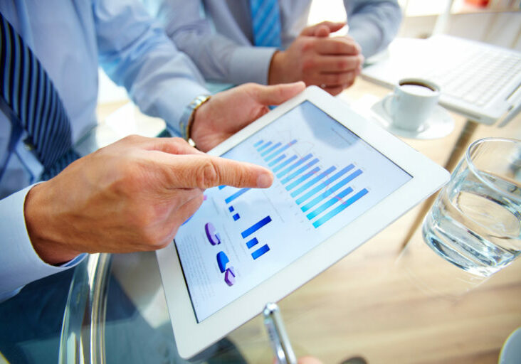 Modern,People,Doing,Business,,Graphs,And,Charts,Being,Demonstrated,On