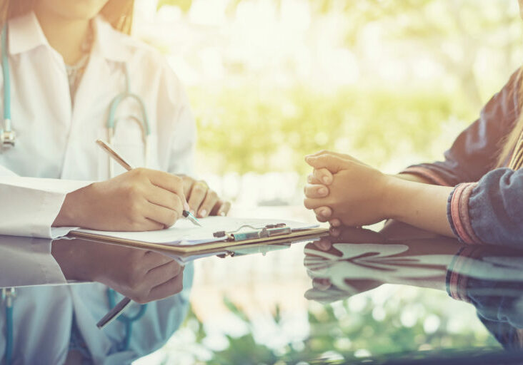 Asian,Female,Doctor,And,Patient,Are,Discussing,Something,,having,Consultation,medical