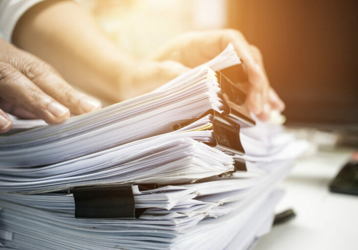 Work,From,Home,,Businessman,Hands,Working,In,Stacks,Of,Paper